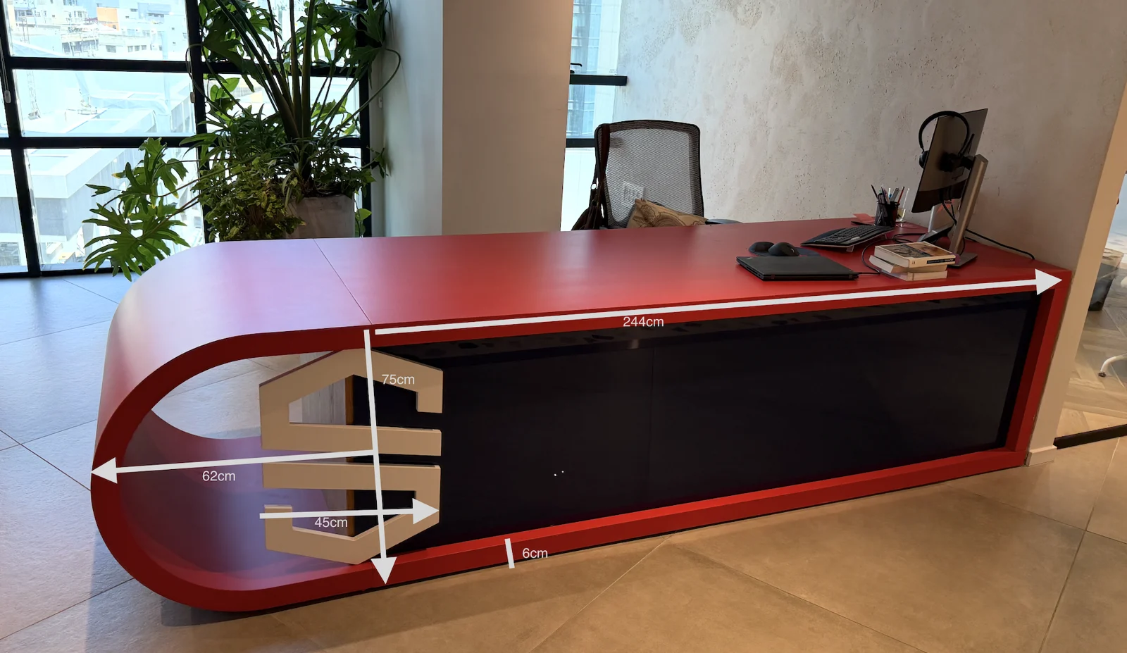 A reception desk shaped around the workplace